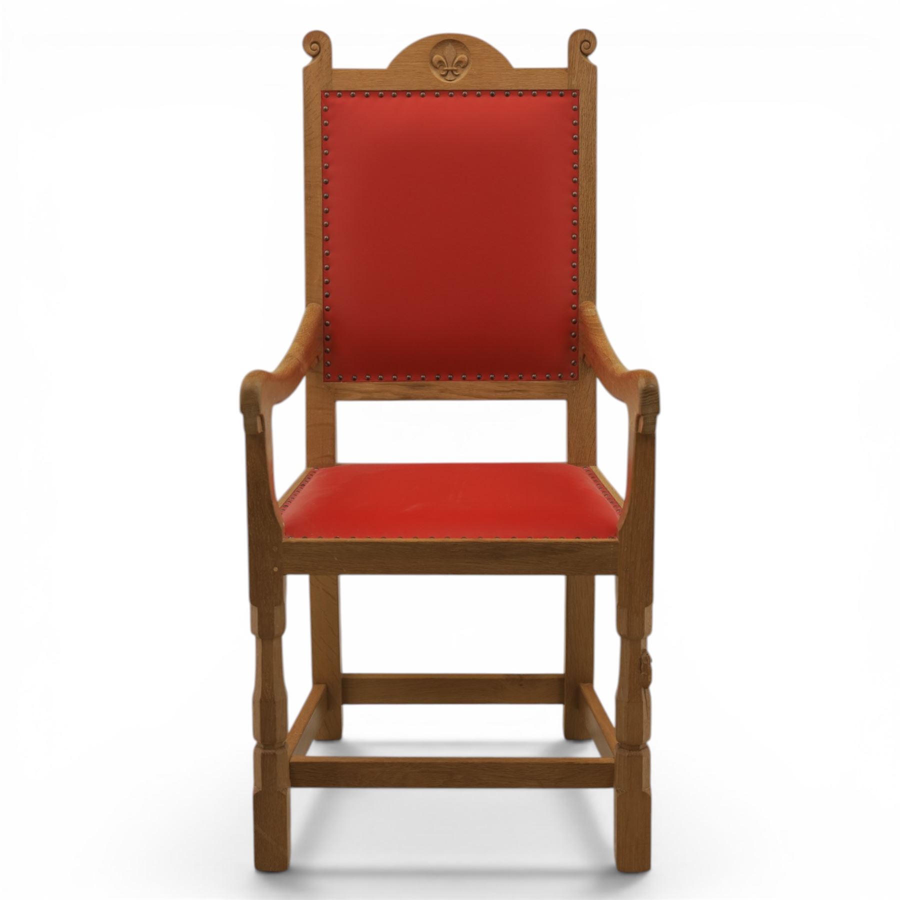Mouseman - oak armchair high back with fleur de lis motif, red leather padded seat with brass studded trim, with carved mouse signature, by the workshop of Robert Thompson of Kilburn