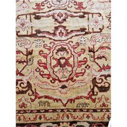 Large pale ground rug, decorated with stylised plant motifs, repeating border with scrolling design
