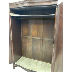 Early 20th century mahogany serpentine double wardrobe, inside fitted with rail and top shelf