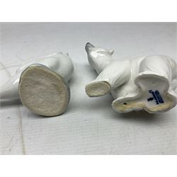 Seven Lladro figures, comprising Playful Puppy no 9135, Platero and Marcelino/Boy Hugging Donkey no 1181, Mini Seal Family no 5318, Attentive Polar Bear no 1207, Seated Polar Bear no1209, Eskimo Boy with Pet no 5238 and Girl with Geese no 1035, together with Nao goose