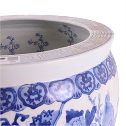 20th century blue and white fishbowl planter, decorated with birds in blossoming branches, internally decorated with goldfish, upon a wooden base, H44cm