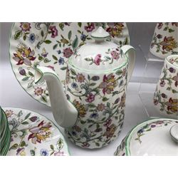 Minton Haddon Hall pattern tea and dinner wares, including basket dish, two covered tureens, six dinner plates, eight dessert plates, twelve tea plates, six soup bowls, six cereal bowls, teapot, coffee pot, milk jug, covered sucrier twelve tea cups and saucers, six mugs, footed bon bon dish, pair of candlestick holders, cake knife and slice etc (81)