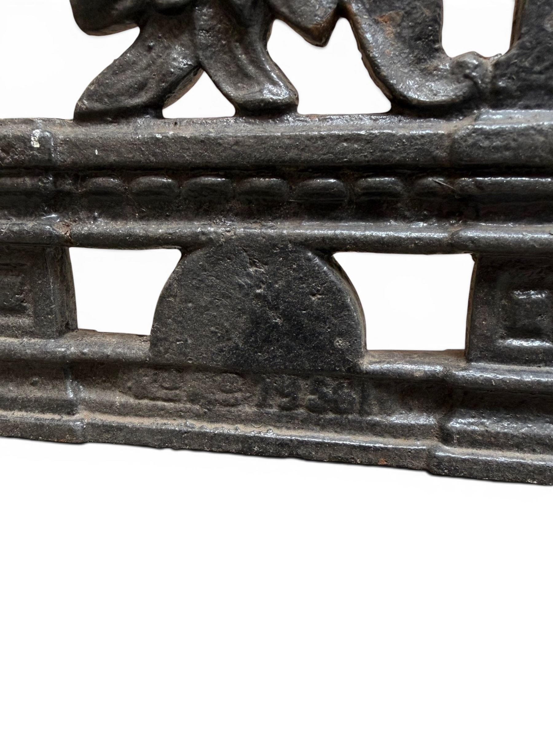 Yates Haywood - pair of Victorian cast iron bench ends, Architectural scrolling design with flower head detail, stamped with period registration number and date