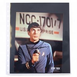 Collection of signed stills and promotional photographs, mostly Sci-Fi TV and film related, including Andy Serkis, Warwick Davis, James Earl Jones, Leroy James, Leonard Nimoy, Billy West, Robert Vaughn, Shane Rimmer, Ethan Phillips etc, all with certificates of authenticity, contained within dark green album