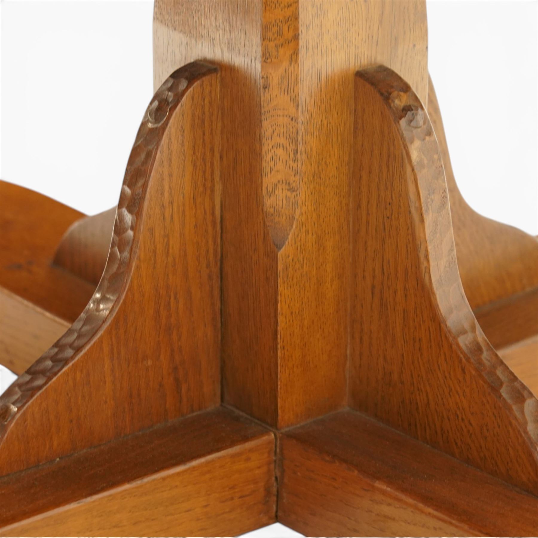 Gnomeman - adzed oak dodecagon dining table, the shaped top raised on a cruciform base with tooled brackets, terminating to four sledge feet, carved with gnome signature, by Thomas Whittaker, Littlebeck, Whitby
