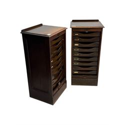 Two early 20th century mahogany tambour cabinets, each with retractable roll-top front revealing fitted interior with concave-front filing drawers and brass fittings