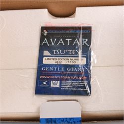 Two limited edition Gentle Giant Avatar 'Tsu'tey' Collectible Mini Busts, both boxed, together with an Avatar choker/bracelet and The Noble Collection Na'vi resin dagger replica on curved display stand