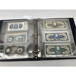 World banknotes, including Queen Elizabeth II The States of Jersey one pound 'DB202703', five pounds 'BB527762' and ten pounds 'AB651481', reserve bank of New Zealand two dollars '1L3 741894', King George V Straits Settlements one dollar 1st January 1935 'F/83 28924', various Bank of England notes etc, housed in two ring binder albums