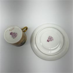 A Royal Worcester fruit painted cabinet coffee can and saucer, hand painted with apples, grapes and raspberries upon a mossy ground, the cup interior and centre of saucer gilded, cup signed H Austin [?], saucer signed H Price, each with puce coloured printed marks beneath, cup H5cm, saucer D11.5cm. 