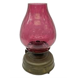 20th century brass oil lamp, with large honeycomb cranberry glass shade, H44cm