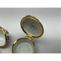 Halcyon Days bonbonniere, modelled as pink roses in a planter painted with a blue and white Japanese scene, together with five Halcyon Days enamel boxes, one a larger example depicting 'The Becket Casket' and four smaller boxes, including The 1993 Easter Egg, Happy Birthday and Statue of Liberty examples, all boxed, Becket Casket D8cm