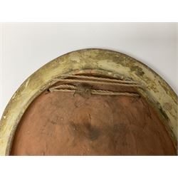 Pair of 19th century classical terracotta relief wall plaques depicting the goddess Hygeia and another goddess, seated holding an ewer, each of oval form, indistinctly signed, each stamped Ferreira verso, H42cm, W30cm