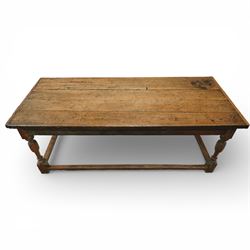 Late 17th to early 18th century oak joint refectory dining table, rectangular four plank top, raised on turned baluster legs, united by chamfered stretchers