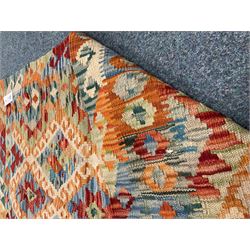Choli Kilim beige ground rug, multi coloured patterned field