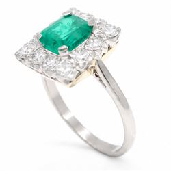 18ct white and yellow gold emerald and diamond cluster ring, single octagonal cut emerald of approx 1.55 carat, surrounded by twelve round brilliant cut diamonds, total diamond weight approx 0.95 carat