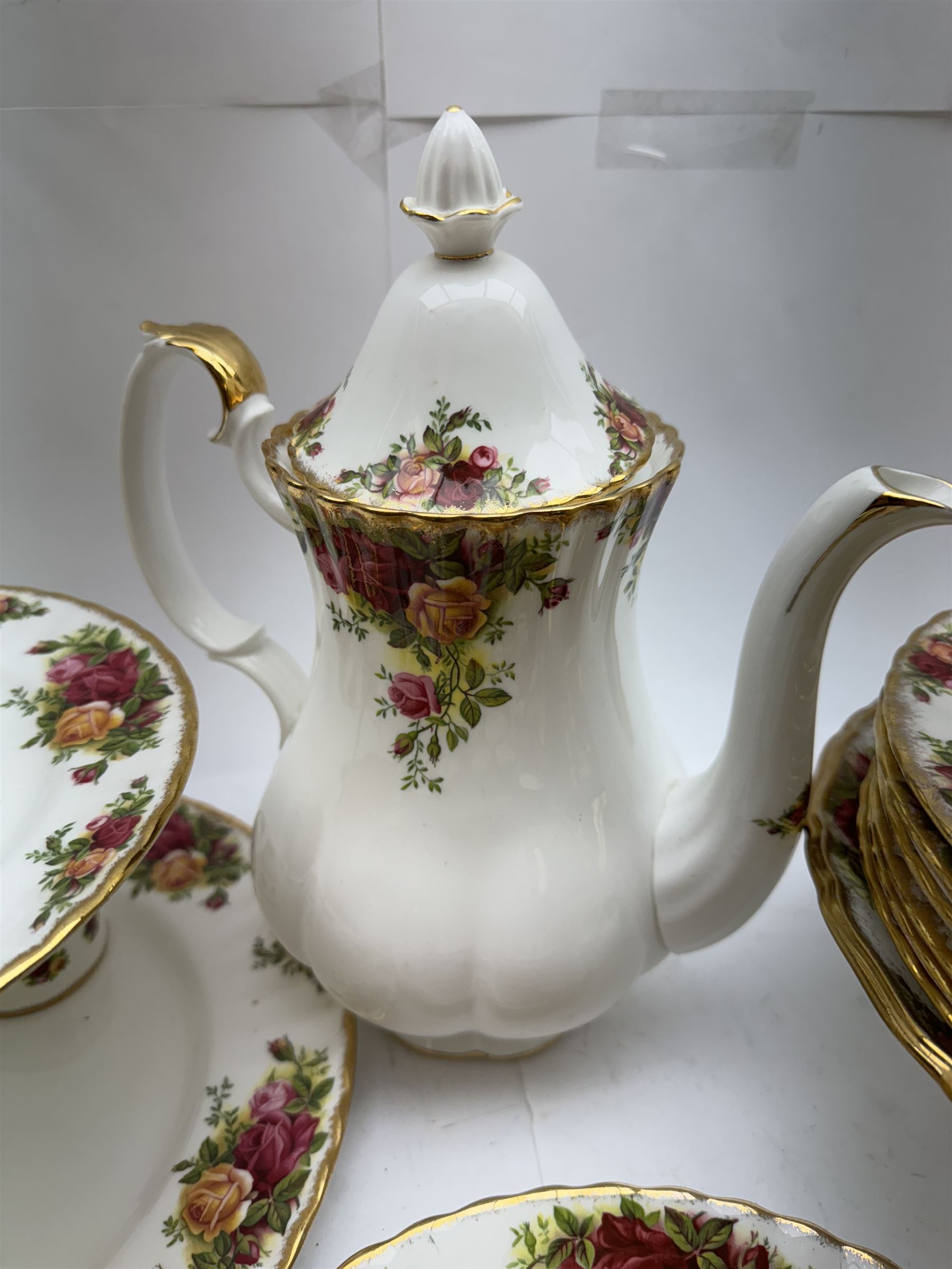 Royal Albert Old Country Roses pattern tea wares, comprising coffee pot, jug and sugar bowl, cake stands, napkin rings, teacups and saucers, side plates, dessert plates, small plates, all with printed marks beneath