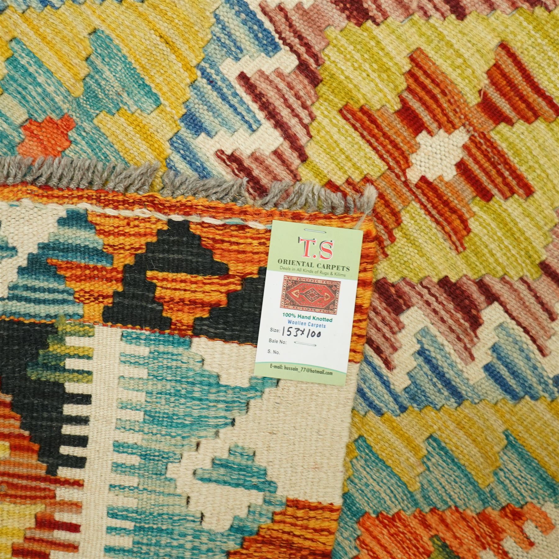 Chobi kilim with staggered diamond and stepped lozenge motifs in a palette of mustard, rust, teal, lilac and cream, the design enclosed by patterned guard stripes