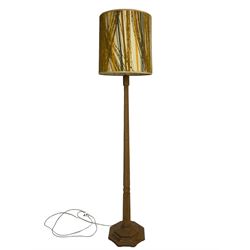 Mouseman - oak standard lamp, octagonal tapered column on octagonal base carved with mouse signature, by the workshop of Robert Thompson, Kilburn