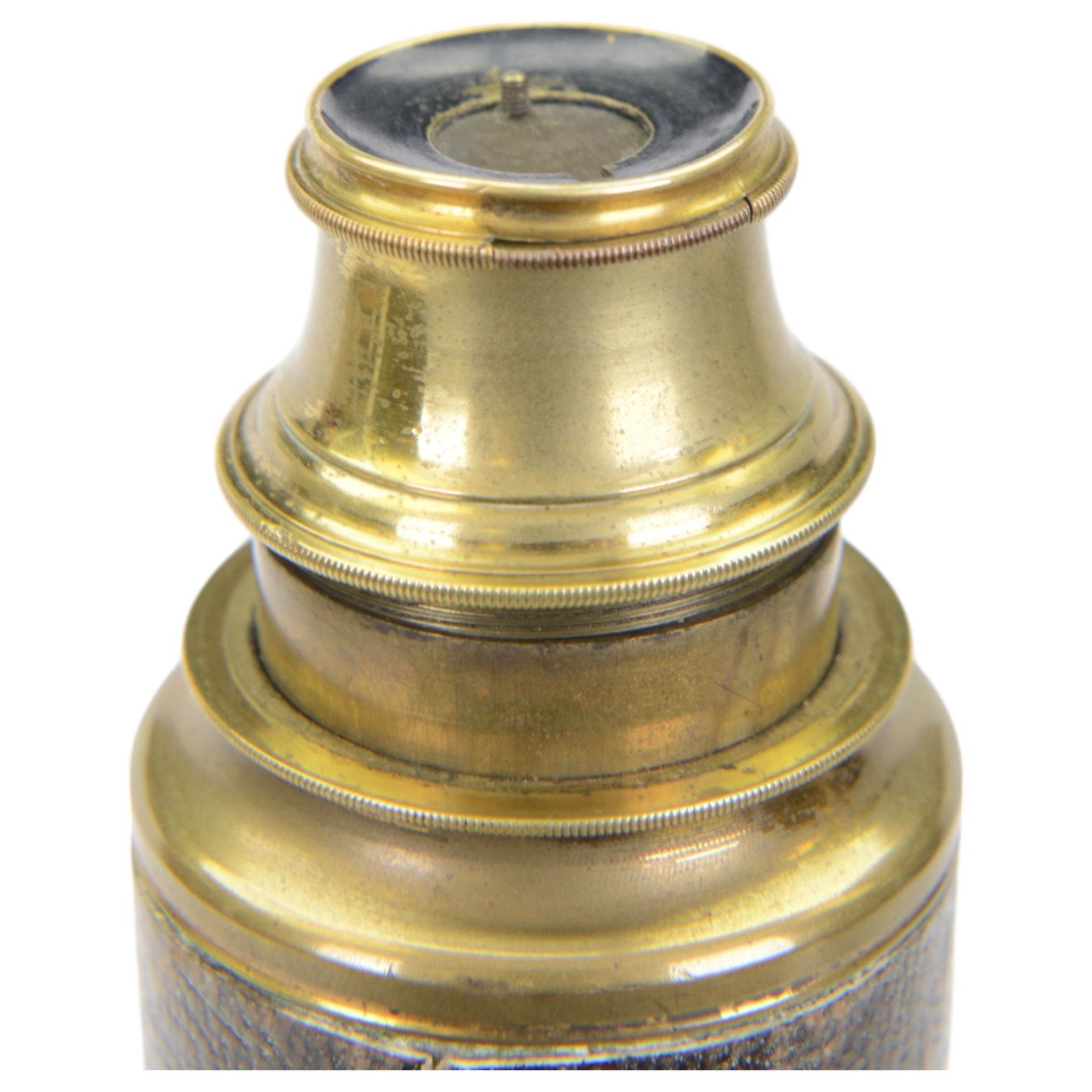 19th century mahogany and brass three drawer telescope, together with a larger leather bound telescope and a large circular metal bound magnifying glass