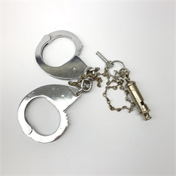 Pair of 1960's Hiatt chromium plated handcuffs with key and a 'Metropolitan' whistle