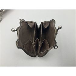 Early 20th century silver mounted coin purse, with leather interior and finger chain, hallmarked Samuel M Levi, Birmingham 1917, together with a similar Edwardian example, with engraved initials and engine turned decoration, hallmarked Birmingham 1907, maker's mark worn and indistinct, largest W11.3cm