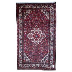 Persian Hamadan rug, the central lozenge medallion on a red field with repeating stylised ...
