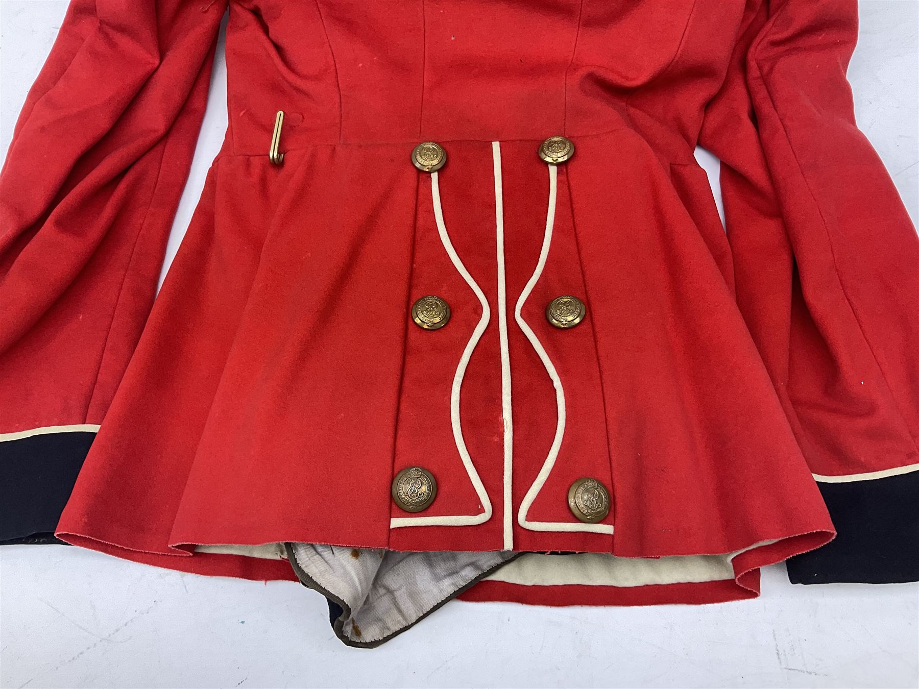 Royal Military College Sandhurst parade uniform with peaked cap and two-piece mess dress, all bearing historic manuscript labels for J.E.A. Baldwin, possibly Air Marshal Sir John Eustace Arthur Baldwin (1892-1975) who served in the British Army 1910-18 & 1944-58 and in the RAF 1918-44.