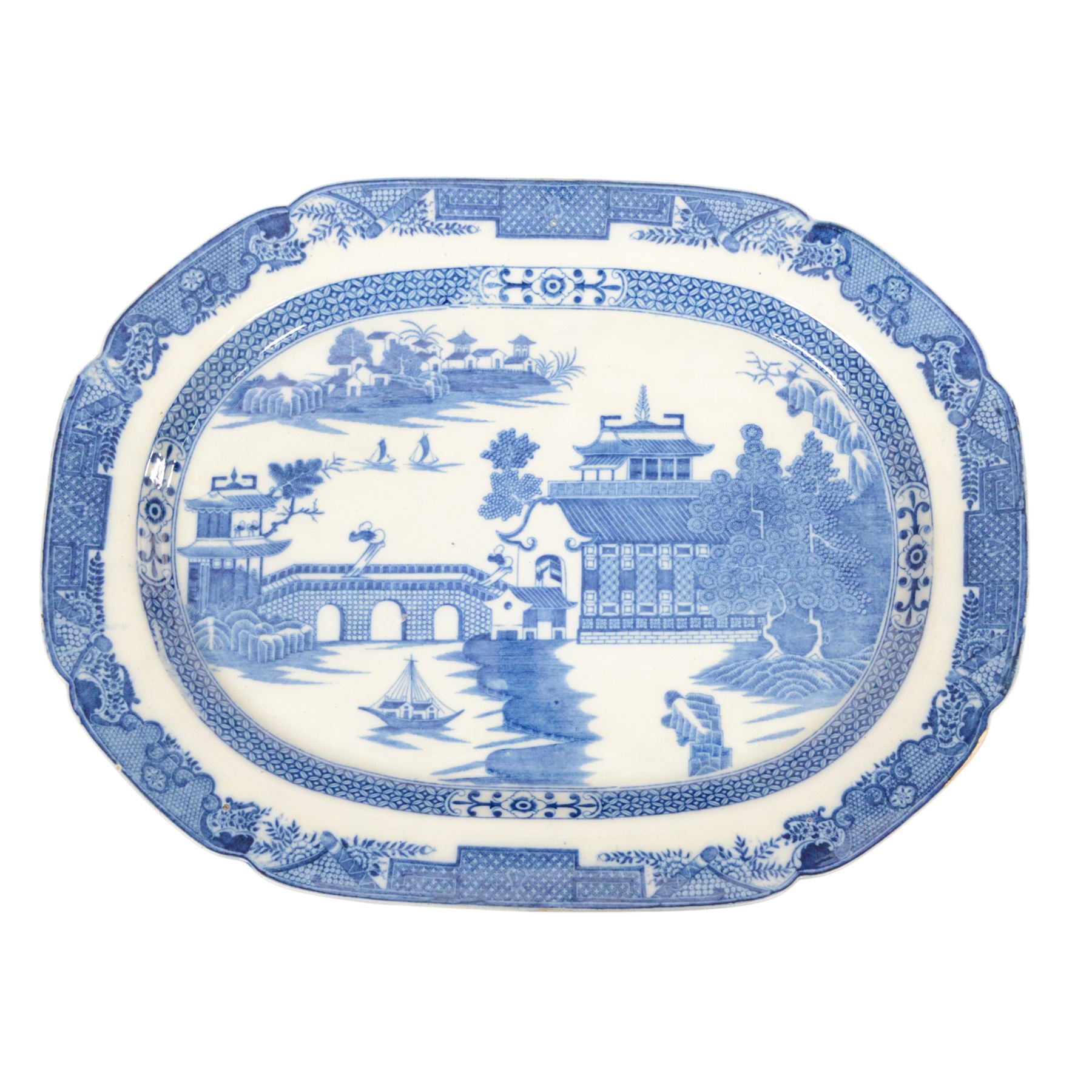 Pair of large 19th century blue and white platters, decorated in the Long Bridge pattern with pagodas, boats and figures, within a decorative border with scrolls, D39.5cm W52cm