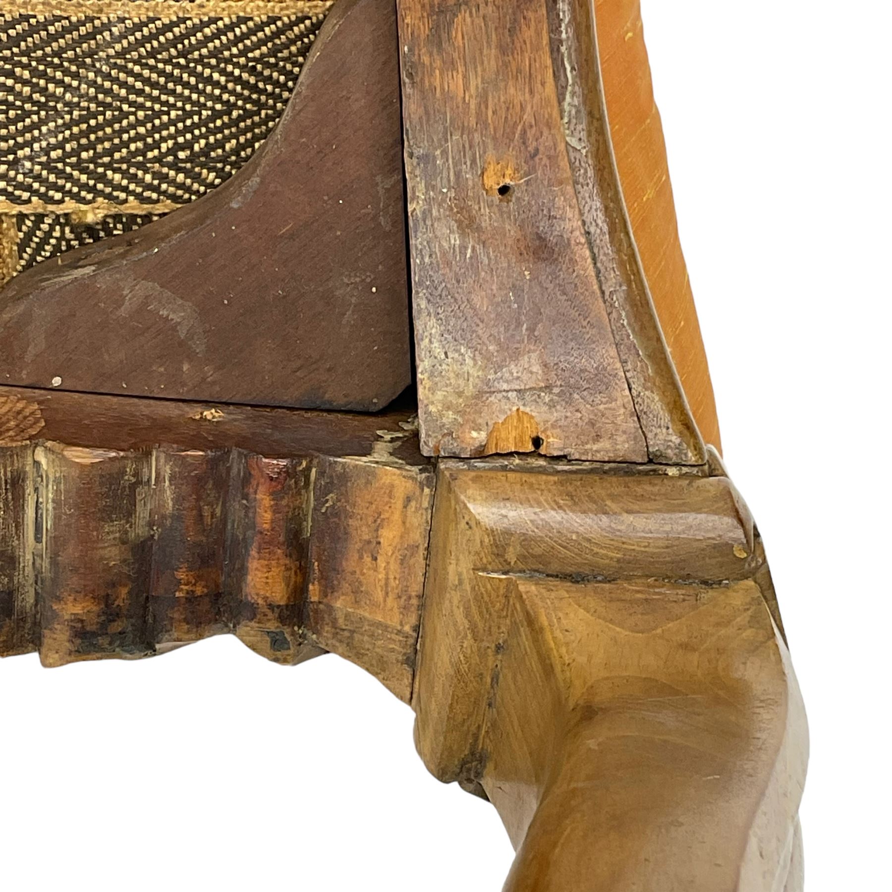 Pair of Victorian walnut side chairs, shaped cresting rail carved with acanthus leaves, overstuffed upholstered seats with stud band, on cabriole supports with scroll carved terminals