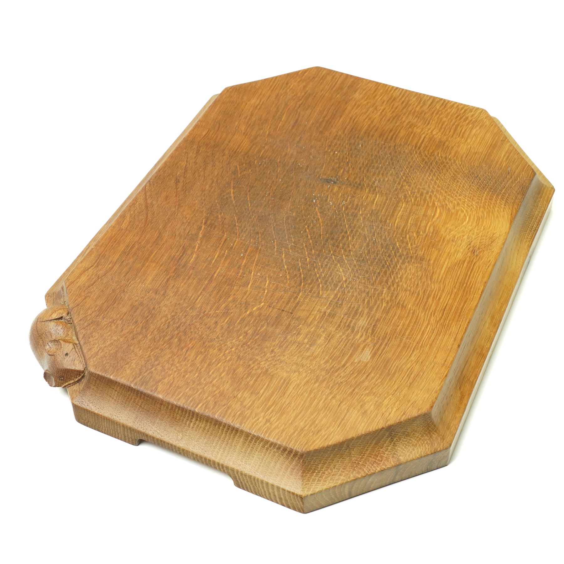 Mouseman - oak chopping board, of canted octagonal form with concave handles, with carved mouse signature, by the workshop of Robert Thompson of Kilburn