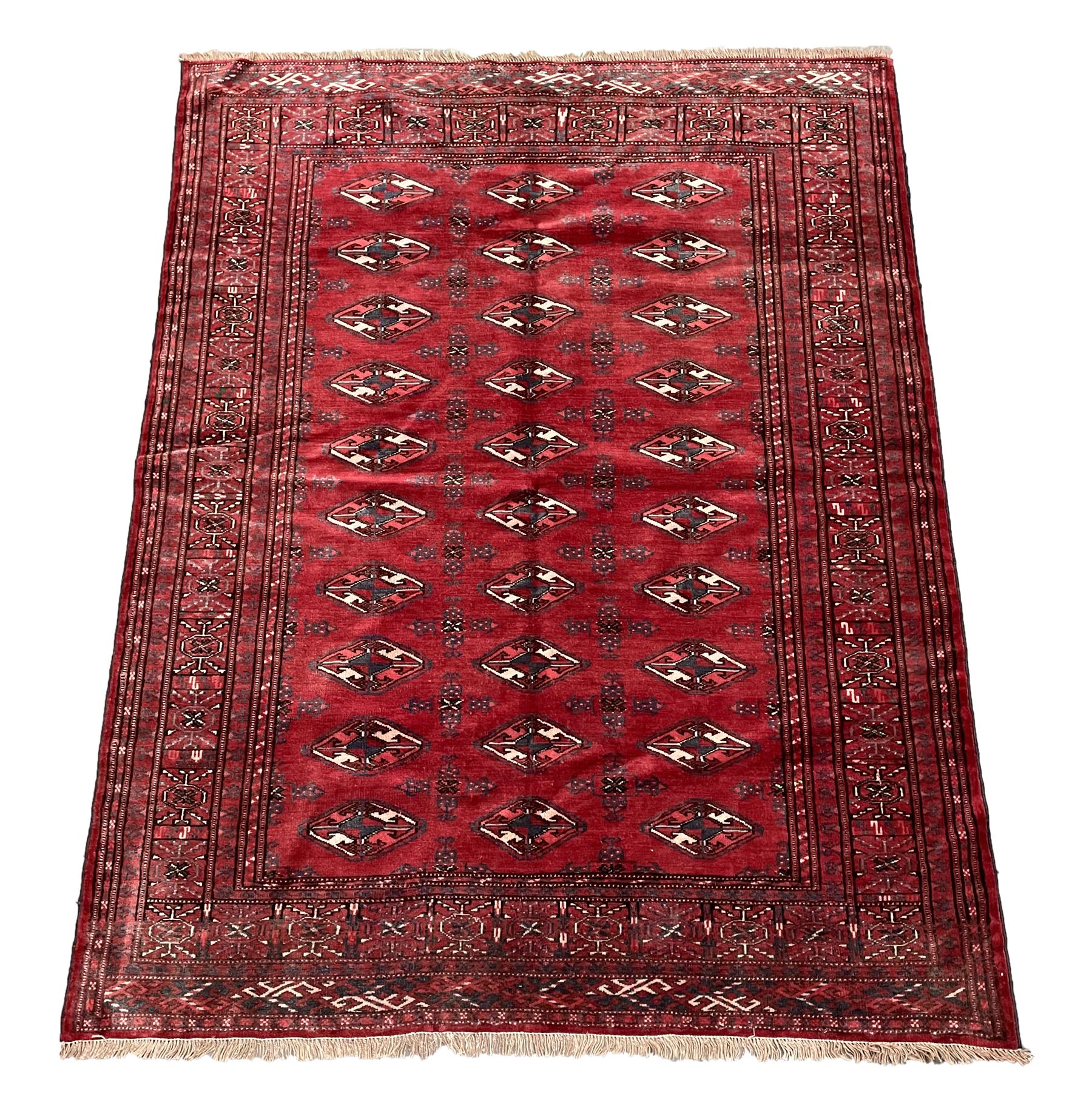 Turkman Bokhara rug, red ground field decorated with repeating Gul motifs