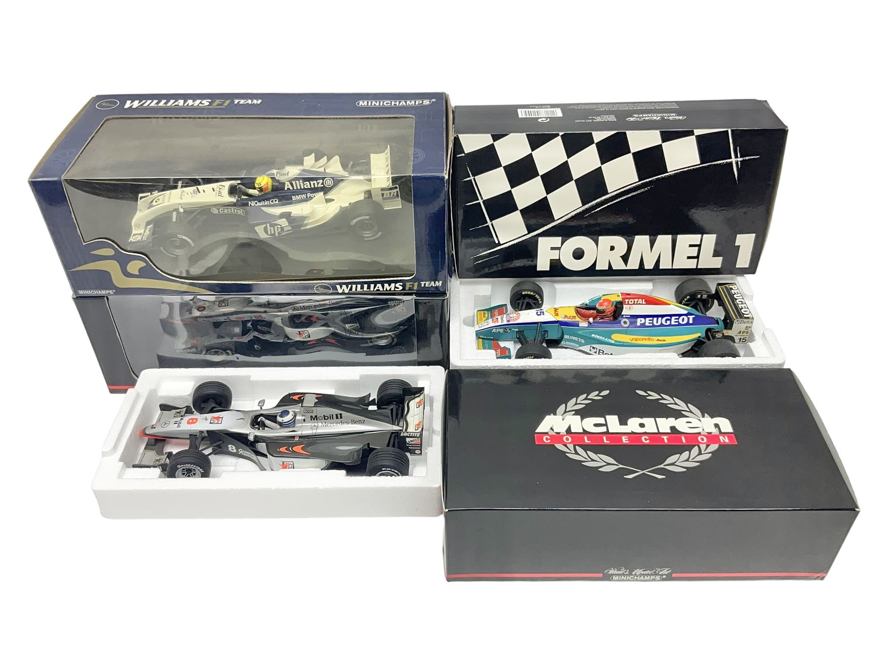 Four Minichamps 1:18 scale die-cast racing cars - Williams F1 Team BMW FW26 R. Schumacher; McLaren Mercedes MP4-12 D. Coulthard; McLaren Mercedes MP4-13 M. Hakkinen; and Formel 1 Jordan peugeot EJR 195 E. Irvine; all boxed (4)