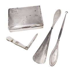  1920s silver mounted cigarette box, of rectangular form, with engraved initials and engine turned decoration to hinged cover, opening to reveal softwood interior, hallmarked E J Trevitt & Sons, Chester 1929, together with a silver handled button hook and shoe horn, and a mother of pearl handled silver fruit knife, all hallmarked, cigarette case W11.5cm, D8.5cm, H3.5cm