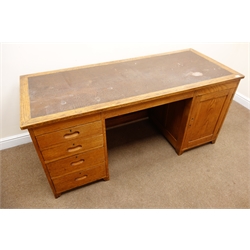  Early 20th century vintage oak twin pedestal office desk, leather inset top, panelled front, four graduating drawers, single cupboard door, stile supports, W167cm, H76cm, D71cm  