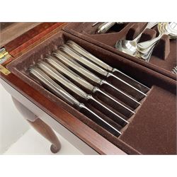 Canteen of Sheffield silver-plate cutlery, housed in mahogany table cabinet with hinged lift up lid, raised on cabriole legs, H49cm W74cm D46cm