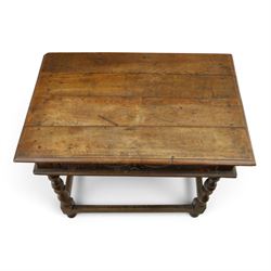 18th century oak lowboy, rectangular top with moulded edge, fitted with single frieze drawer carved with scrolling fruiting vines and stylised plant motifs, raised on bobbin-turned supports united by box stretcher 