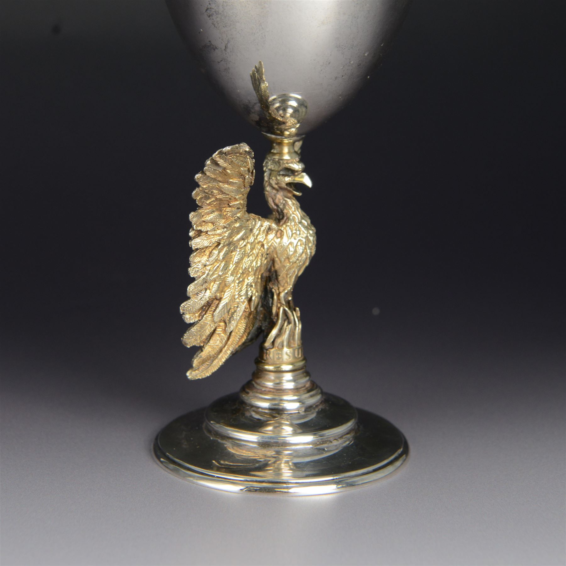 Modern limited edition silver goblet, 'made by order of the Dean and Chapter of St Paul's to commemorate the 300th anniversary of the laying of the foundation stone of the cathedral in 1675', designed by Jocelyn Burton for Aurum, the plain bowl with gilt interior, upon a parcel gilt stem in the form of a phoenix with wings outstretched,  limited edition no. 497, hallmarked Jocelyn Burton, London 1975, H16cm, boxed