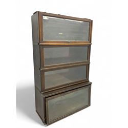 Globe Wernicke - early 20th century oak four-tier stacking library bookcase, four glazed sections enclosed by hinged and sliding doors