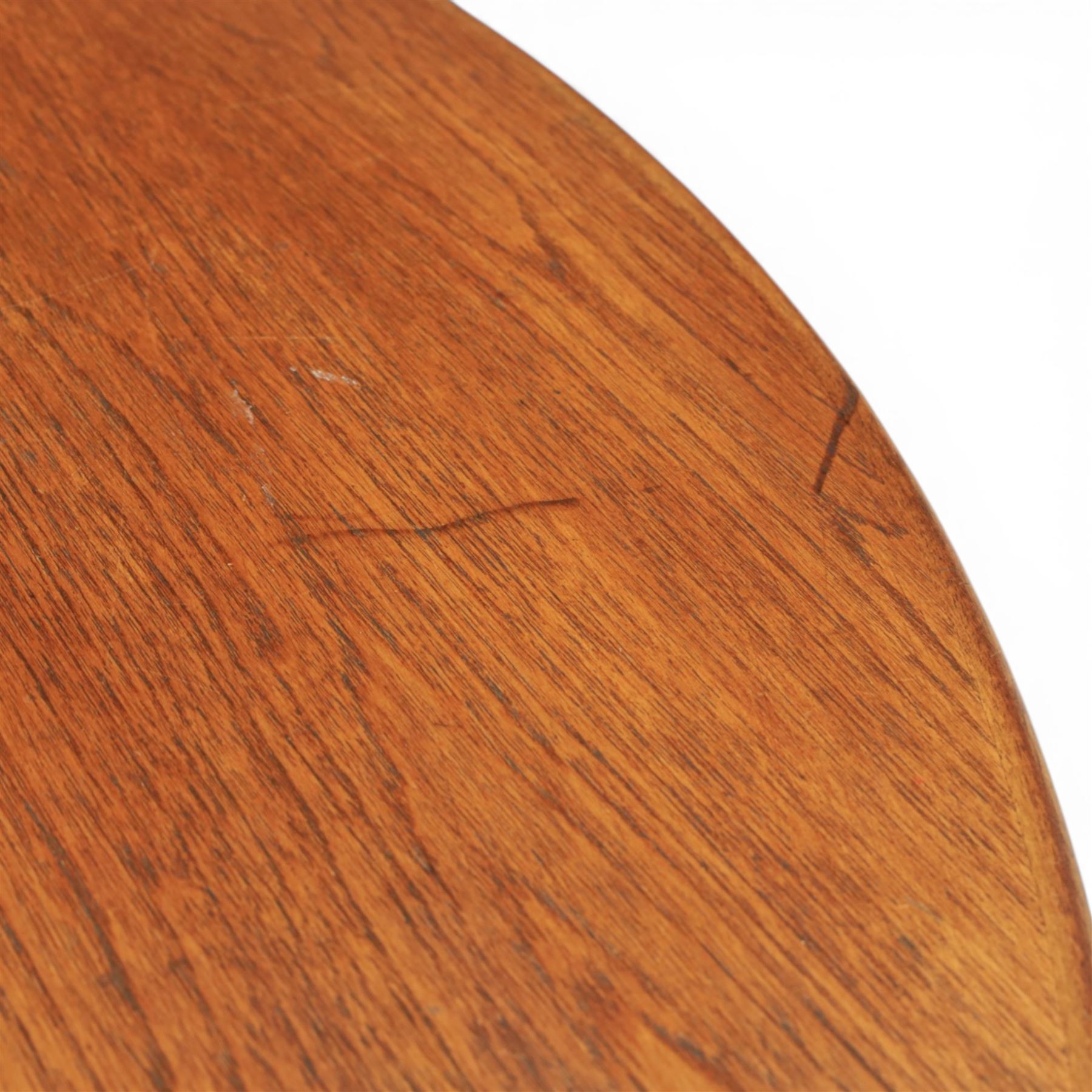 A H McIntosh & Co of Kirkcaldy - teak circular top with moulded edge enclosing butterfly leaf extension, raised on four tapering supports, extending action revealing central leaf, 167cm fully extended