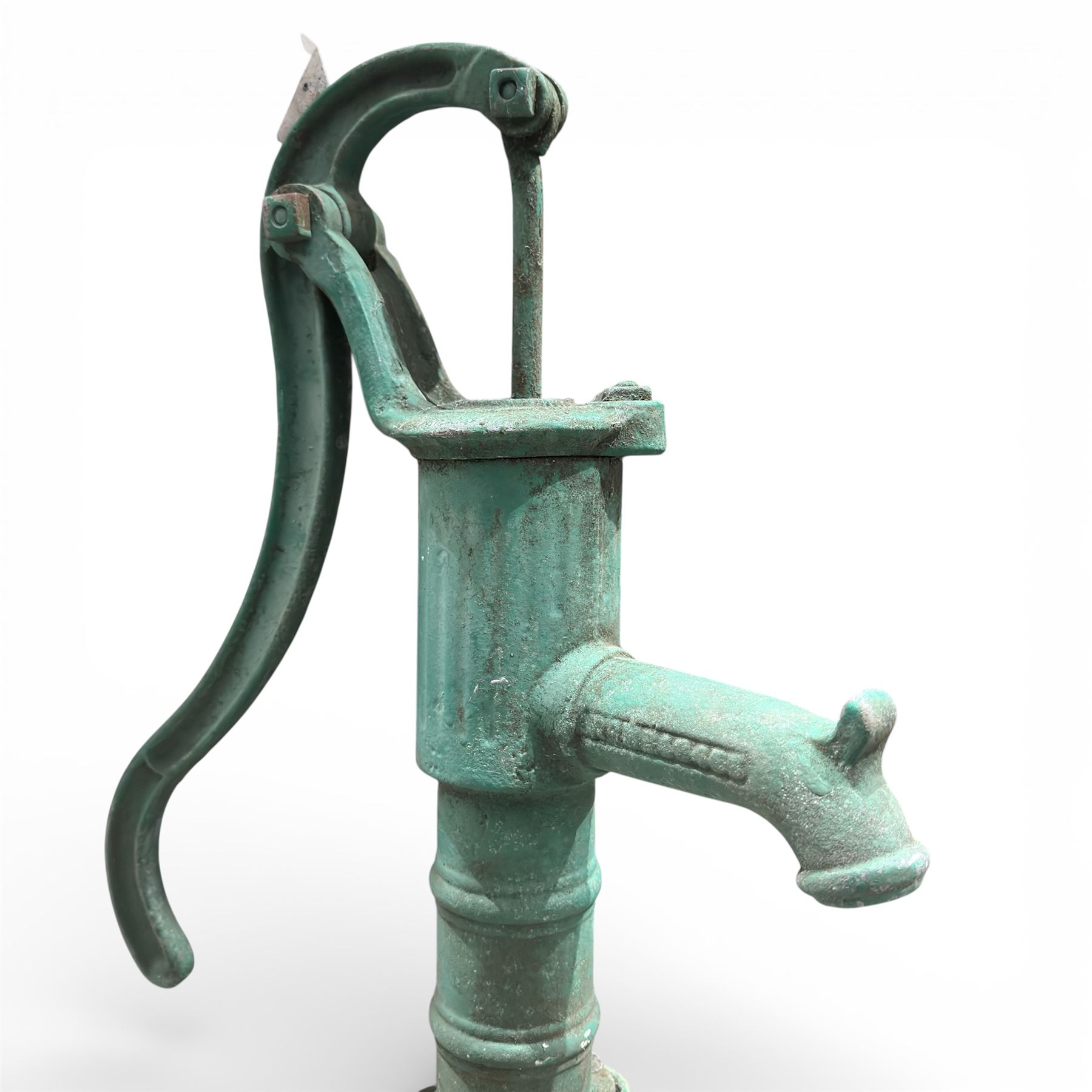Cast stone bird bath on pedestal with cast iron water pump