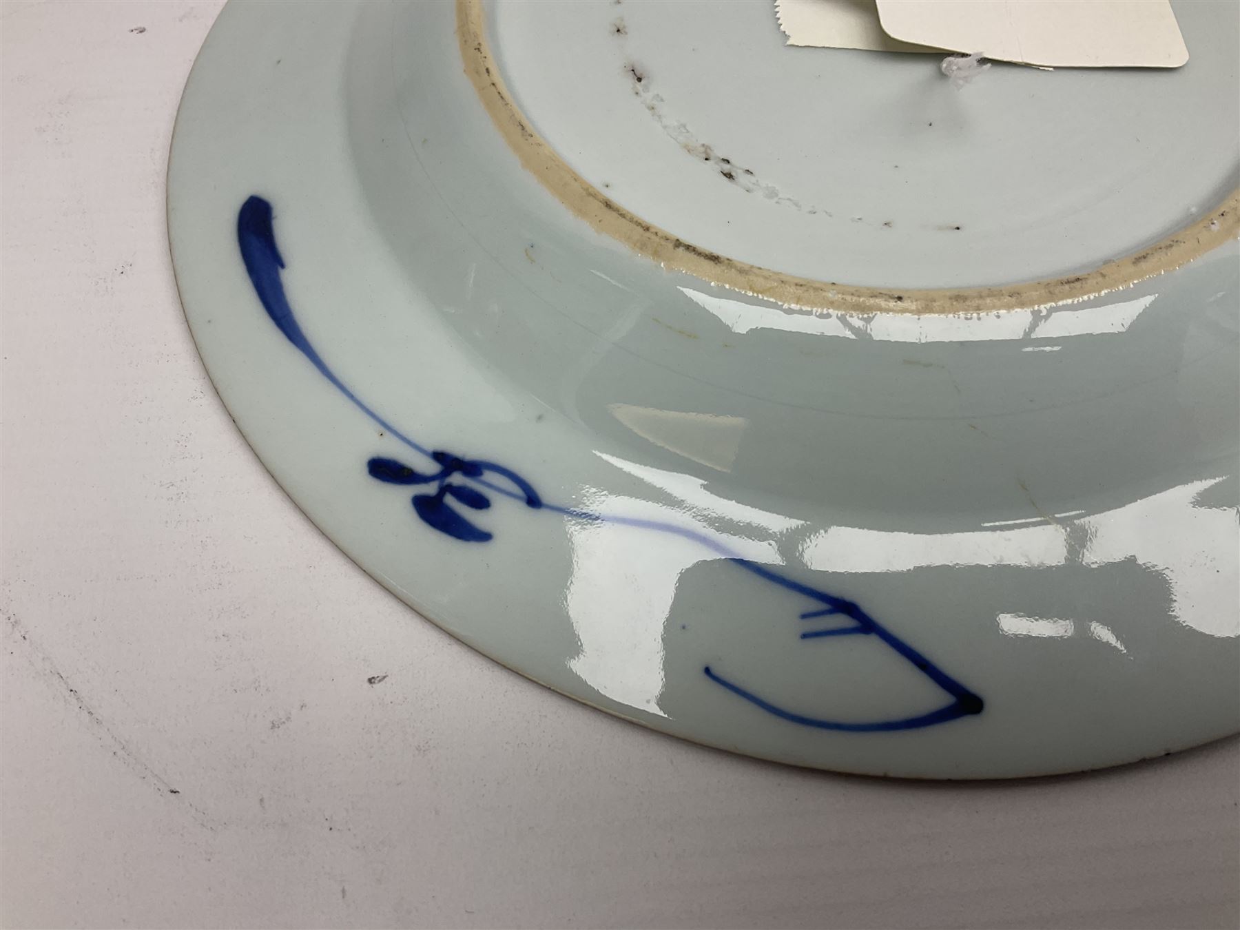 Japanese Meiji period Arita blue and white plate, of circular form, painted with riverside landscape and bird upon flowering branch, with character mark beneath, D24.5cm, together with two 18th century Chinese blue and white plates, each painted with floral design, each approximately D22.5cm