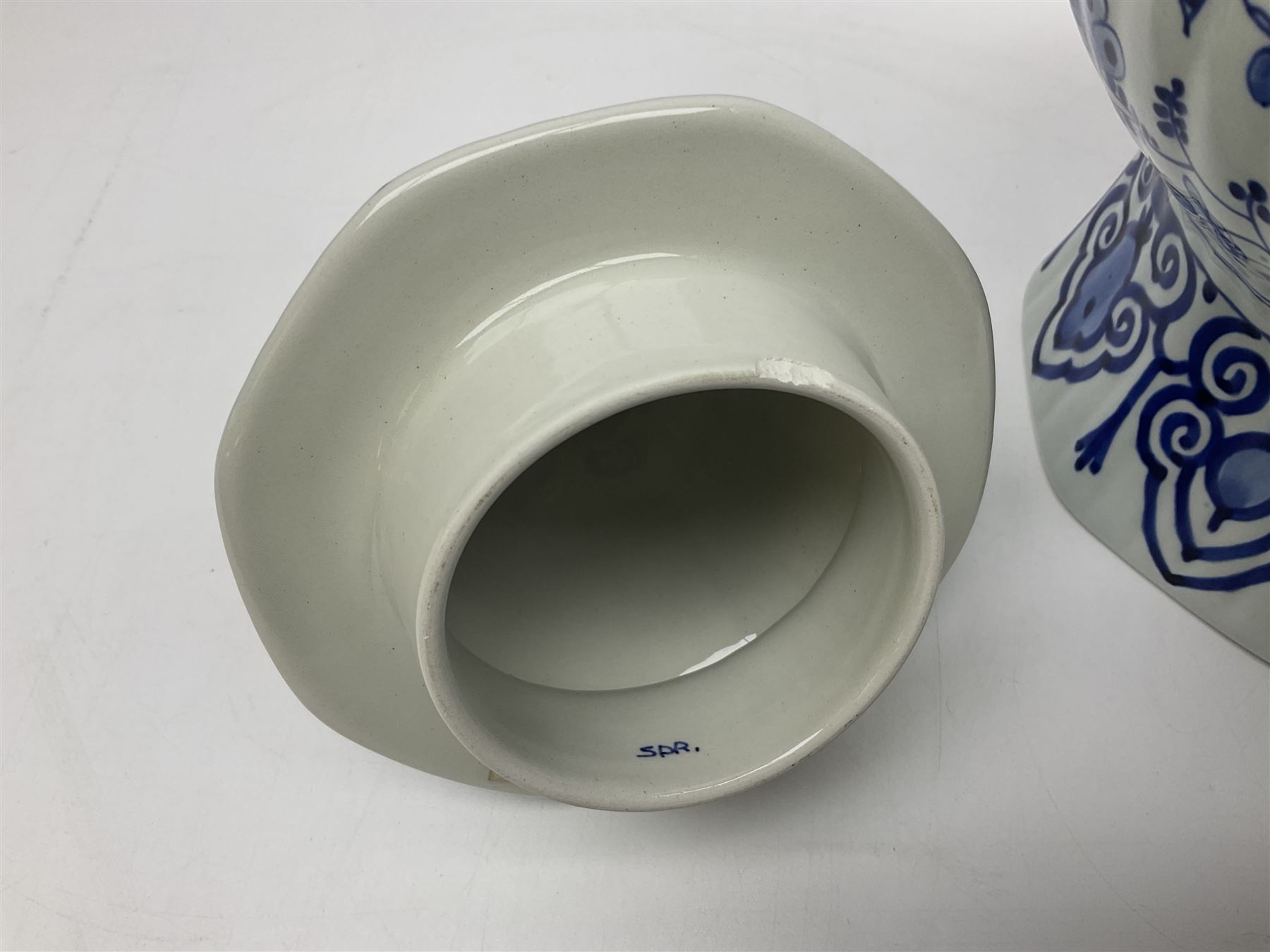 De Porceleyne Fles Delftware blue and white covered jar, of fluted baluster form, with floral and insect decoration, upon an octagonal foot, the octagonal cover with urn shaped finial, H32cm