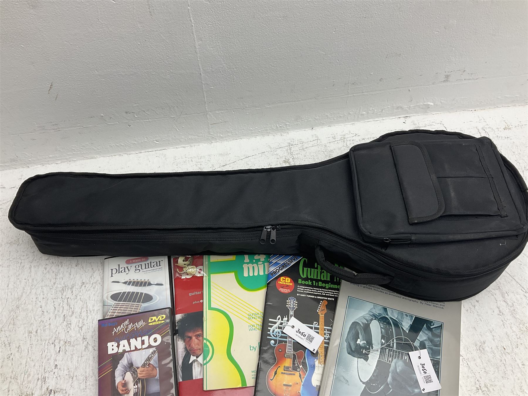 Rally five-string banjo with mahogany solid back L101cm in soft carrying case; and Brunswick Model BF200 acoustic guitar L103cm; with small quantity of instructional DVDs and booklets