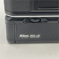 Nikon FE2 camera body, serial no. 2043167, with 'Nikon Zoom-NIKKOR 35-70mm 1:3.3-4.5' lens, serial no 3006624 and Nikon MD-12 Motor Drive, serial no. 1679037
