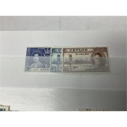 King George V Silver Jubilee stamps 1910-1935 including Bermuda marginal mint block of four, Virgin Islands marginal mint blocks of four including variations/errors, other similar blocks of four etc, various Royal Silver Wedding 1948 stamps, King George VI Victory 8th June 1946, Queen Elizabeth II Coronation etc, housed in a stockbook