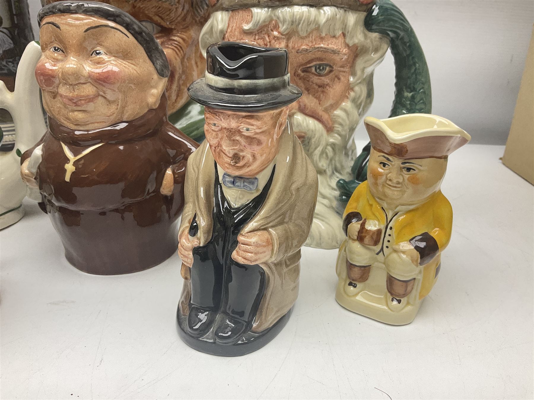 Collection of toby jugs and character jugs, to include Royal Doulton Winston Churchill and Neptune, together with Staffordshire Character Jugs examples  