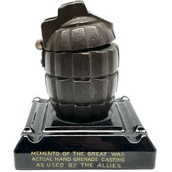WWI First World War commemorative British Army hand grenade display. Comprising of a genuine WWI Grenade casting, mounted atop a pottery display base which reads ' Memento Of The Great War - Actual Hand Grenade Casting As Used By The Allies ' and dated 1915 to reverse registration no 651542 