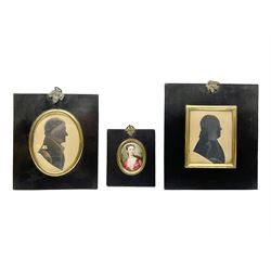 Two 19th century silhouettes, the first example depicting the side profile of Thomas Smallwood, with details highlighted in gilt and label verso, the second example depicting the side profile of an older gentleman, both in lacquered wooden frames, together with a enamel portrait of a young female, tallest frame H16.7cm