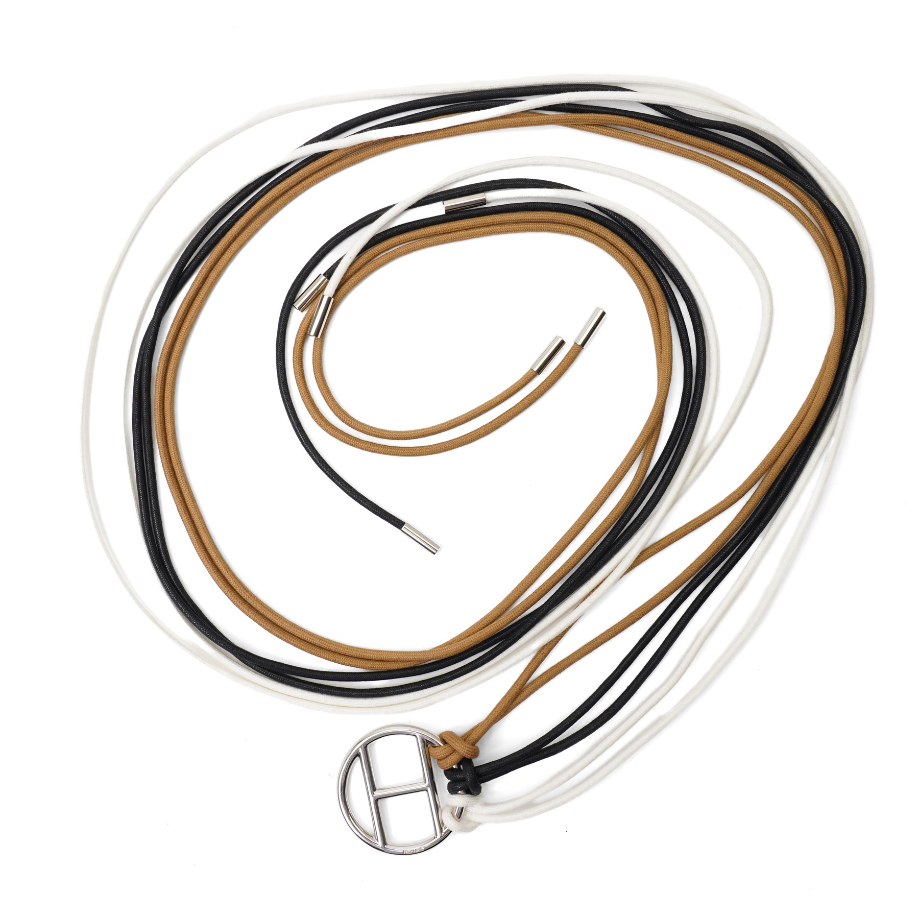 Hermès - long multi-cord belt in black, white and camel, suspending a large palladium-tone circular openwork H pendant, signed HERMES, in original box