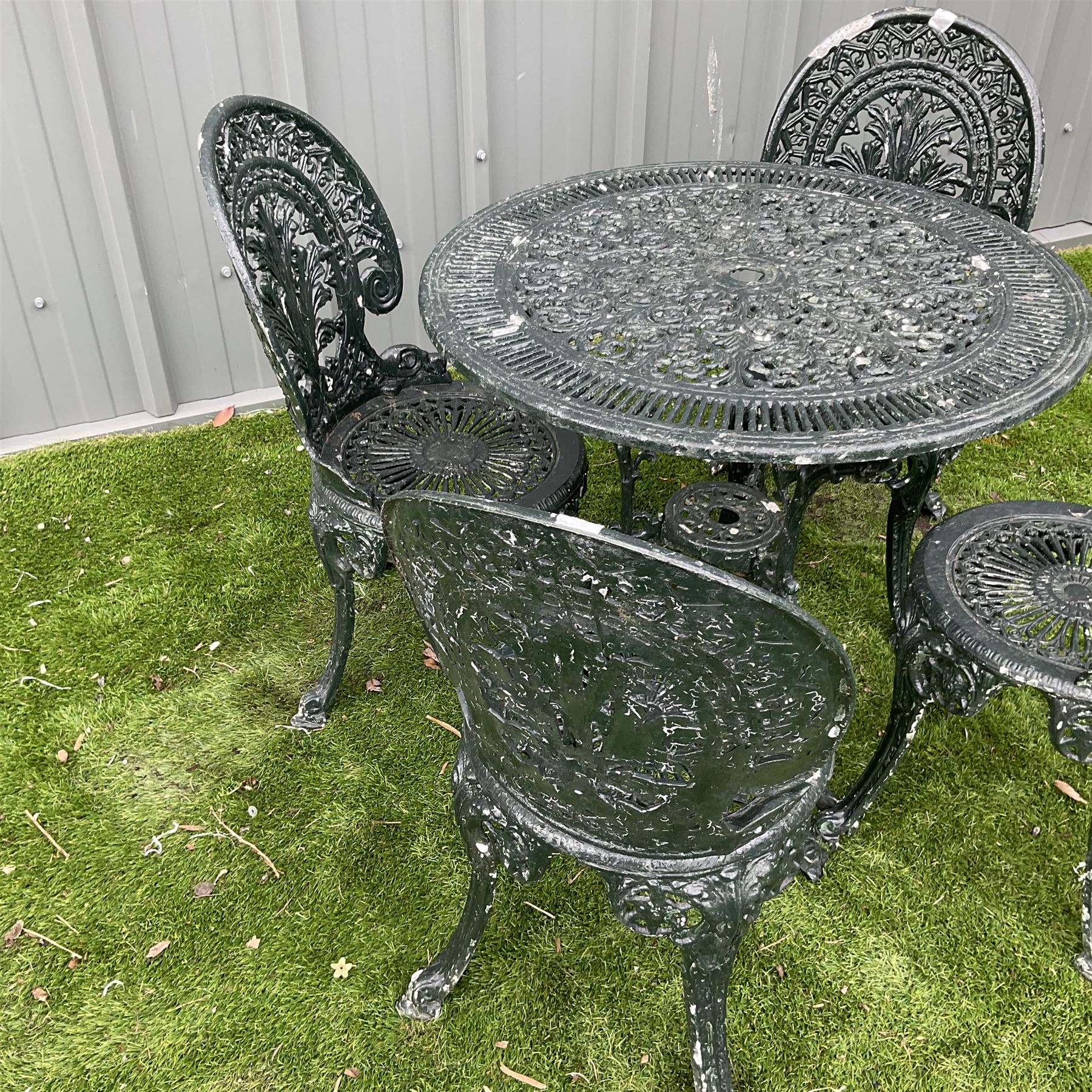 Victorian design cast aluminium circular garden table, and four chairs